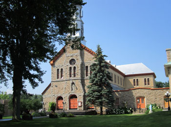 The Montebello church, surrounded by greenery.