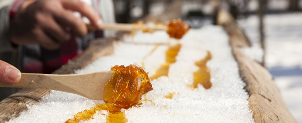 Maple taffy on snow at sucrerie des Gallant