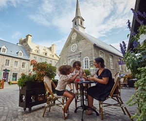 A family dining on Place Royale