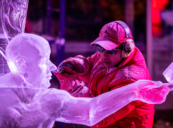 Artist creating an ice sculpture