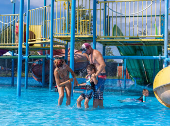 Parents and their son in the water games at Complexe Atlantide