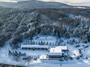 Aerial view of the Hotel Horizon and surrounding area covered in snow
