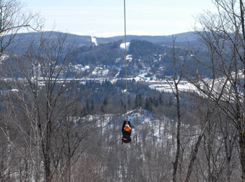 Mega-zipline in the winter at TYROPARC, a mountain adventure park in the Laurentians